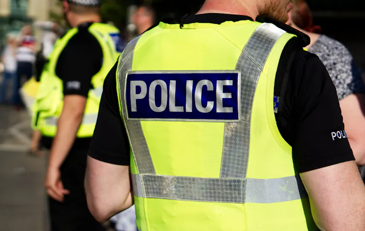 Police officers in hi-vis vests.
