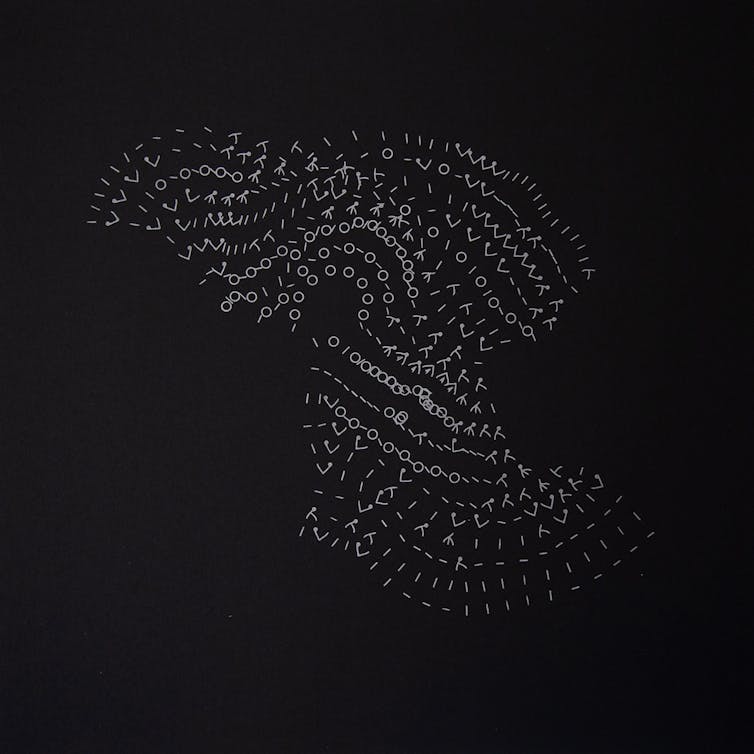 silver knitting symbols on black background