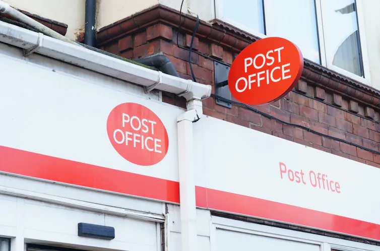A Post Office exterior with double signage.