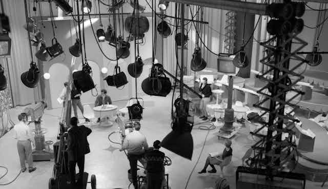 A black and white photo of a 1960s TV studio from above. 
