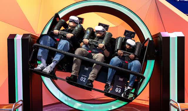 People in VR goggles on a ride