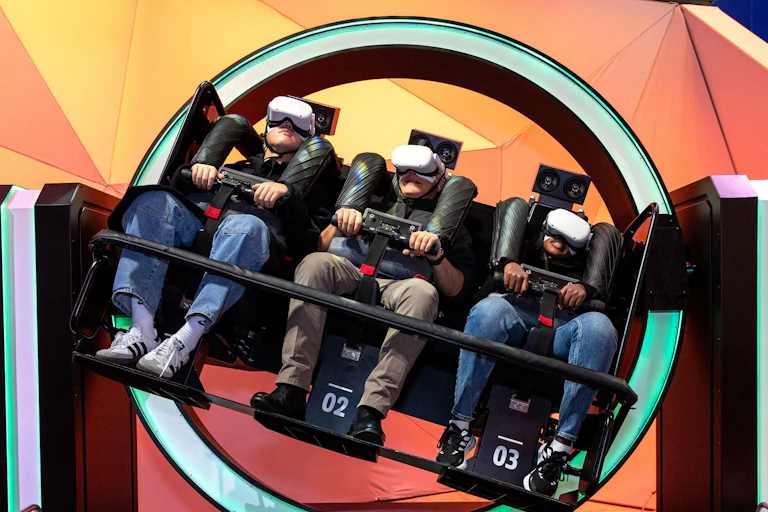 People in VR goggles on a ride