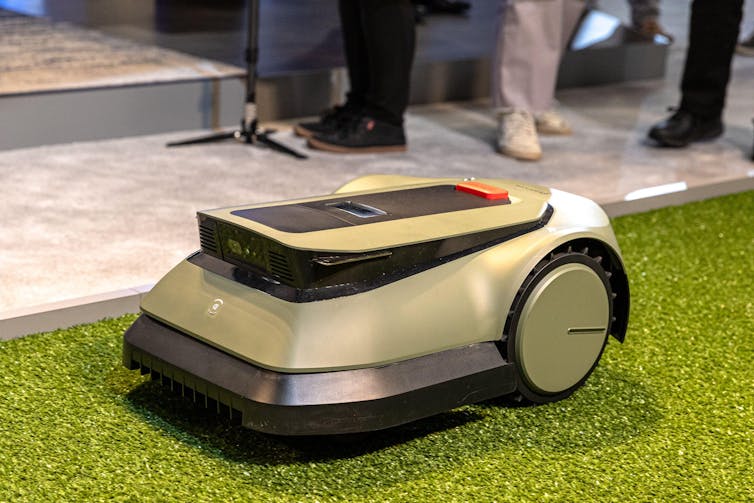 A small electric lawnmower on display at CES