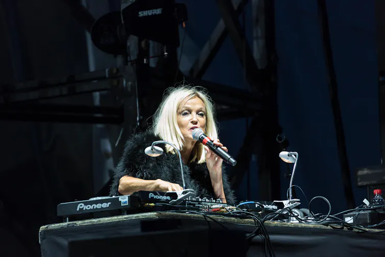 Annie stood at a DJ deck.