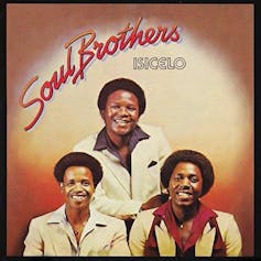 Three men in Afros on an album cover.