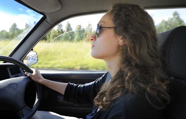 Woman drives car
