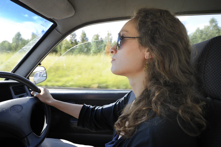 Woman drives car
