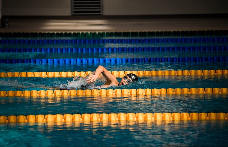 A swimmer training alone in a pool
