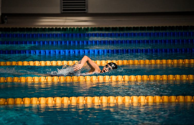 A swimmer training alone in a pool