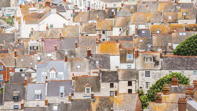 An aerial view of rooftops in an English town.