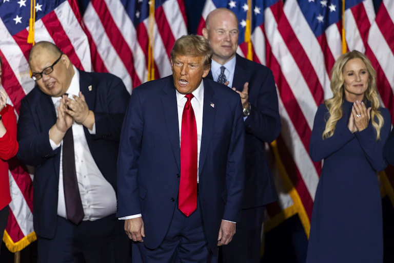 DOnald Trump with senior members of his team celebrate his win in the Iowa caucus, January 2024.