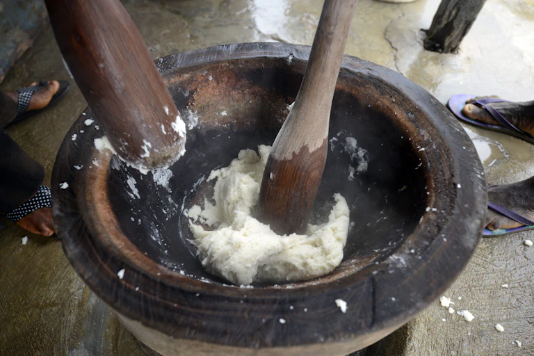 Pestles pounding food in a mortar