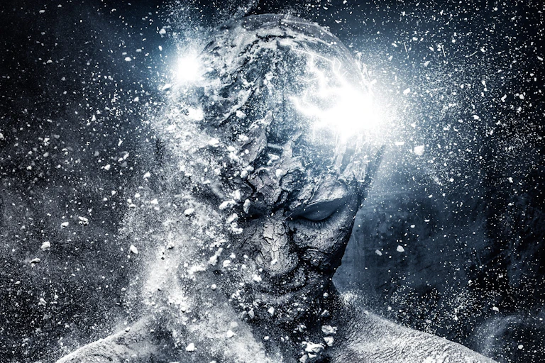 A head shown covered in silver glitter.
