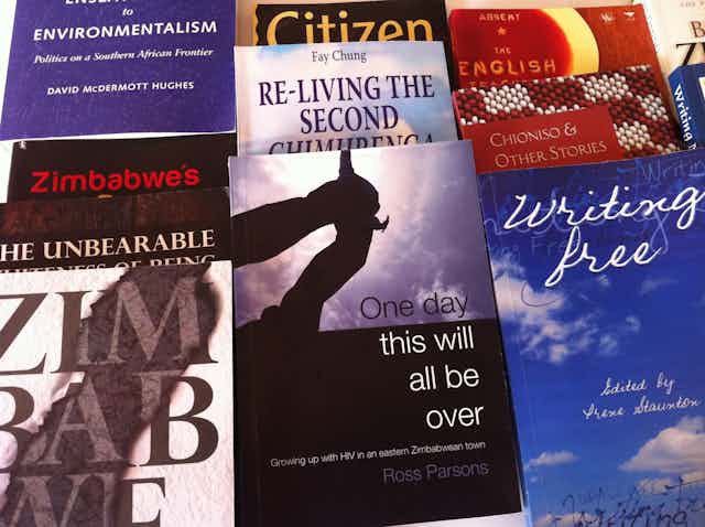 Book covers next to one another, references in titles to Zimbabwe, freedom, environmentalism.
