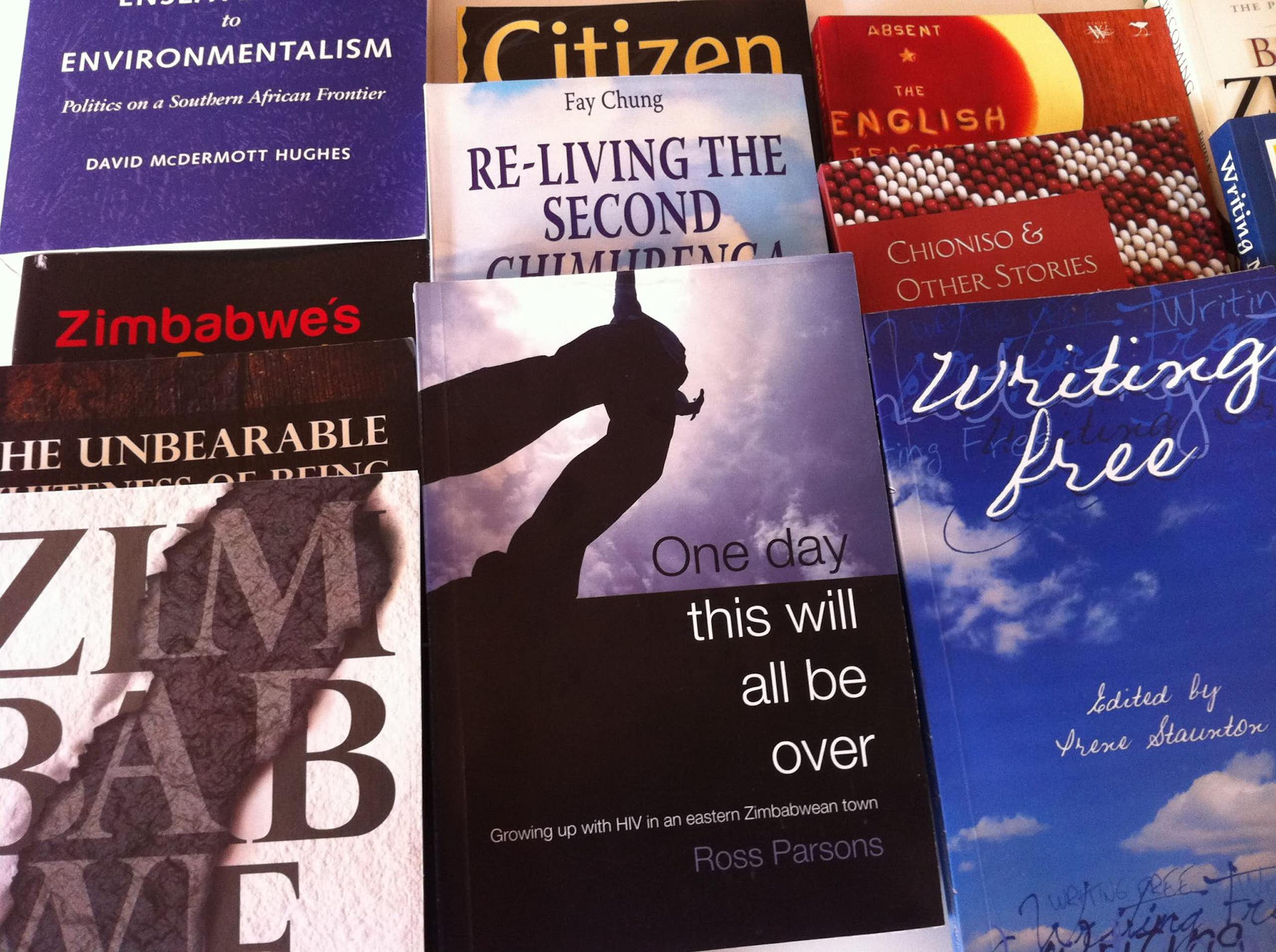 Book covers next to one another, references in titles to Zimbabwe, freedom, environmentalism.