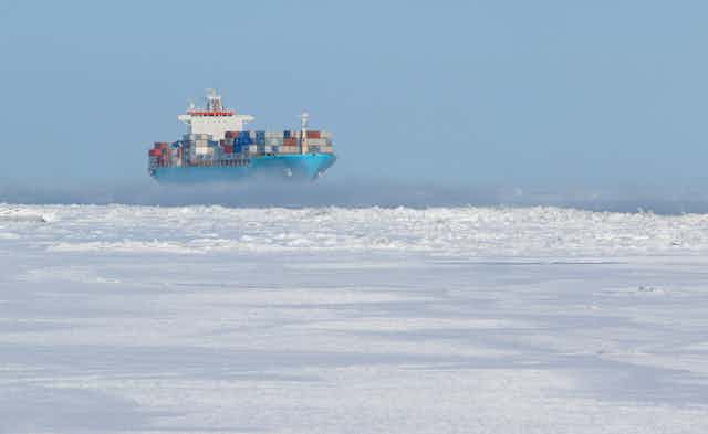 A cargo ship on icy waters.