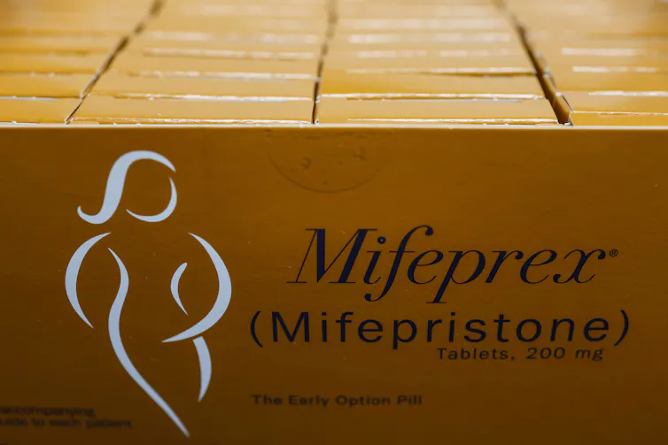 Orange boxes of a drug called Mifepristone.