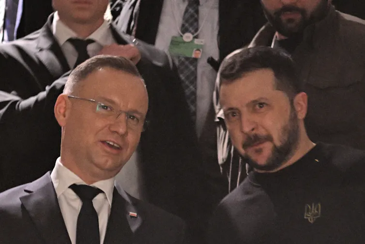 Polish president Andrzej Duda talks with Ukrainian president Volodymyr Zelensky at the World Economy Forum in Davos, January 2024.