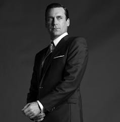 A very handsome 1950s man in a smart suit.