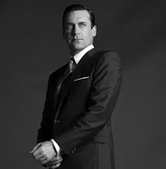 A very handsome 1950s man in a smart suit.