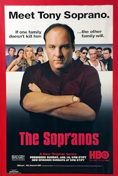 A promo poster for The Sopranos showing lead James Gandolfini with his arms crossed.