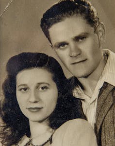 A black and white photograph of a young couple.