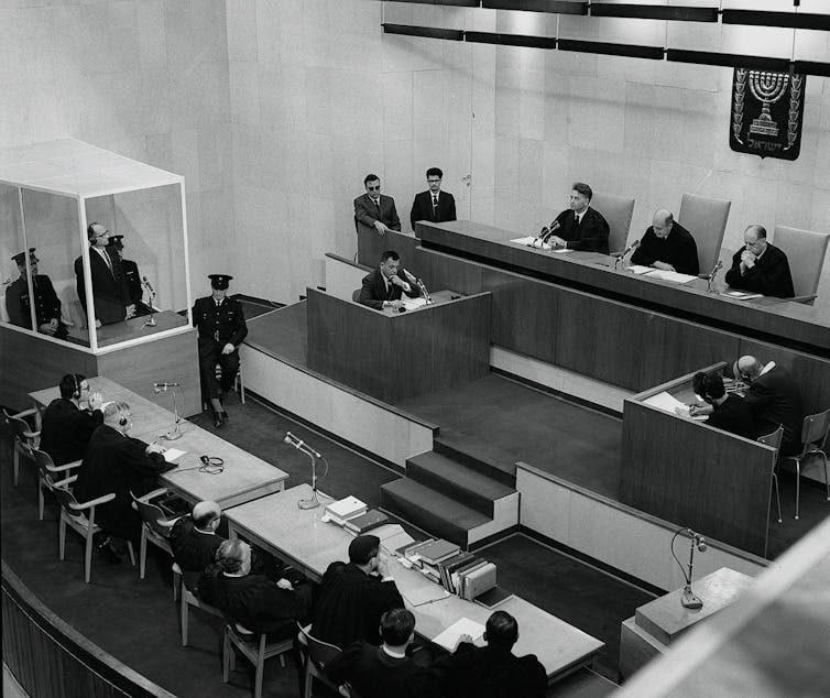 A black and white photograph of a court trial.