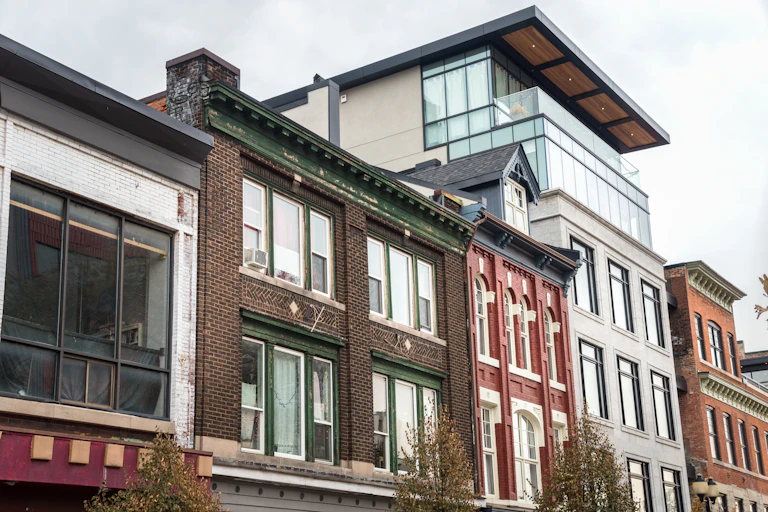 a row of modern and older red brick housing