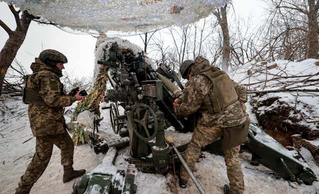 Ukrainians load and fire an artillery piece on the frontlines near  Zaporizhzhiia 