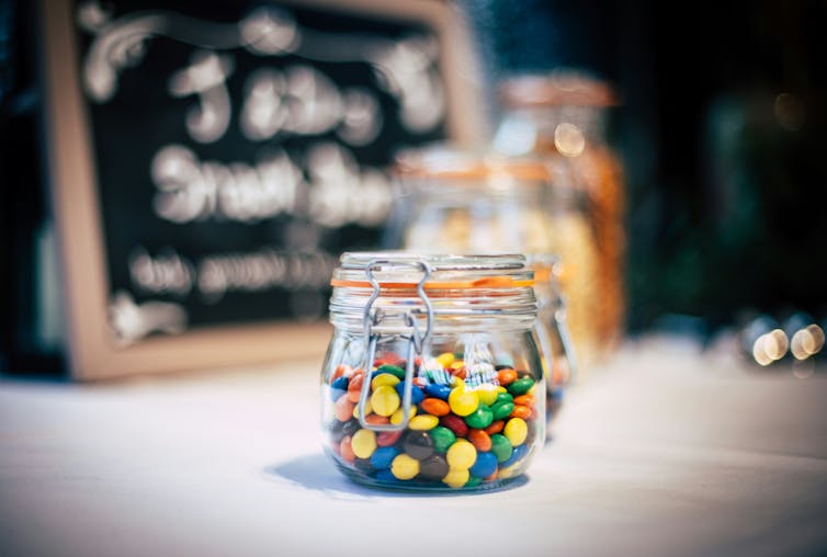 Jar of colorful candy on a table