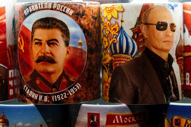Coffee mugs with images of Josef Stalin and Vladimir Putin.