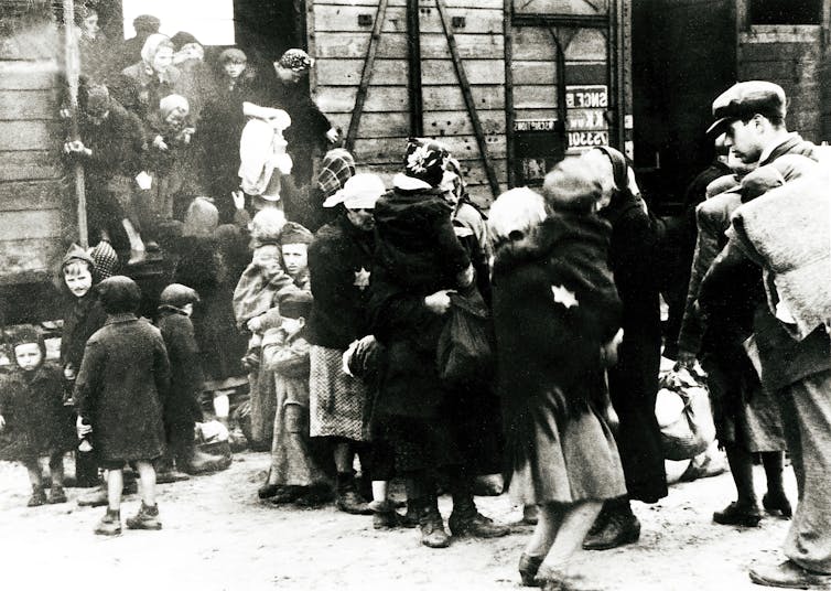 An archival photograph of prisoners arriving at the Auschwitz-Birkenau concentration camp.