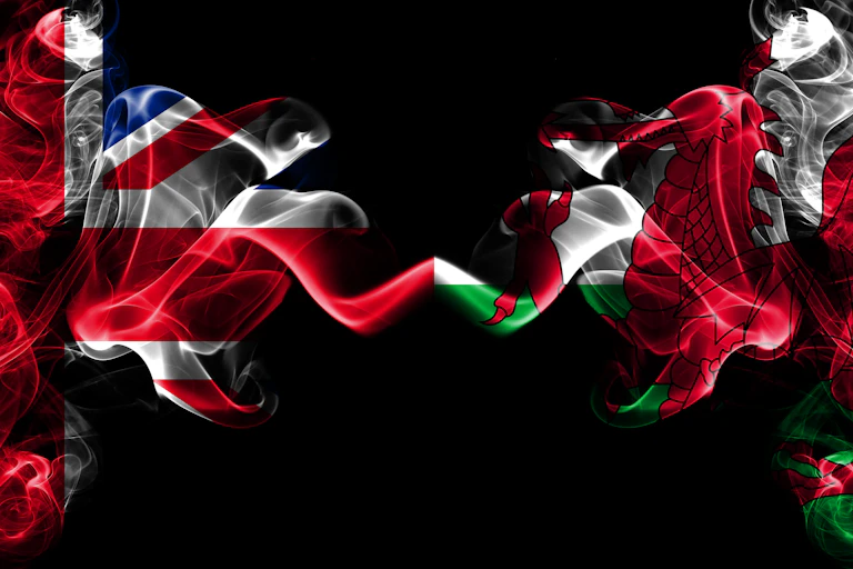 A graphic showing a smoky union flag on the left and a smokey Wales flag on the right.