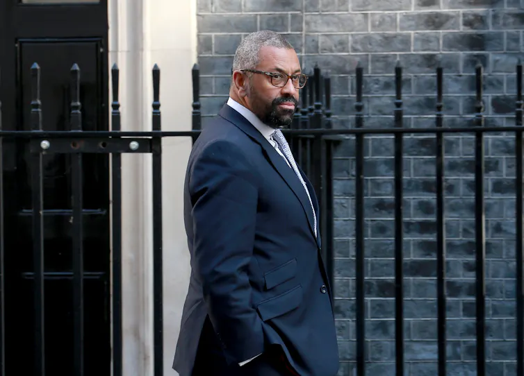 Home secretary James Cleverley walking past Number 10 Downing Street