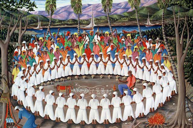 A painting showing people, mostly dressed in white with hands folded in prayer, standing in a circle around a man performing a ritual in the center..