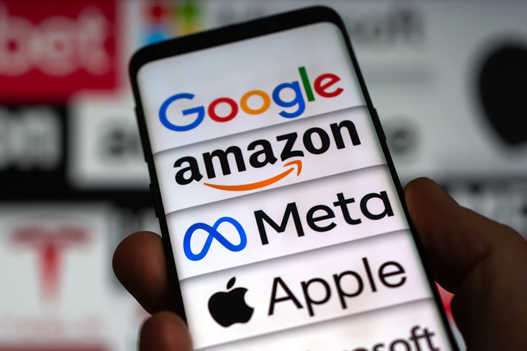 A smartphone with big tech logos displayed