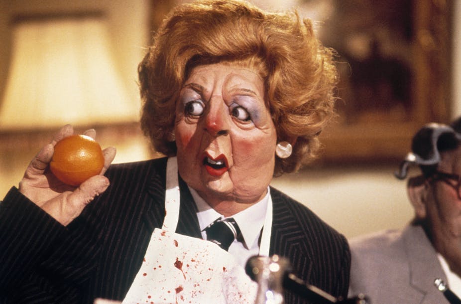 Puppet of Thatcher holding a tomato.