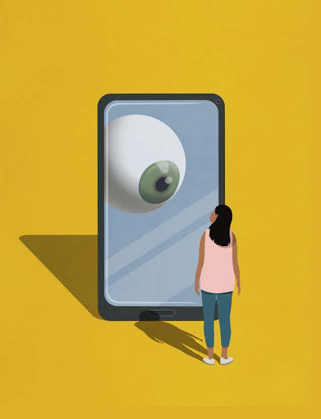 an illustration of a woman standing in front of a giant smartphone that has an eyeball on the screen looking at her