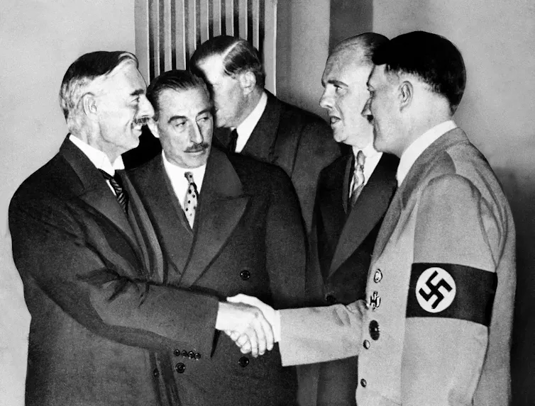 British prime minister, Neville Chamberlain, shakes hands with Adolf Hitler