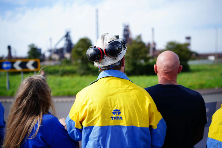 Steelworkers look at steelworks