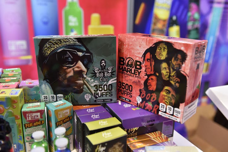 Colorful boxes featuring cartoon drawings of Black men smoking.