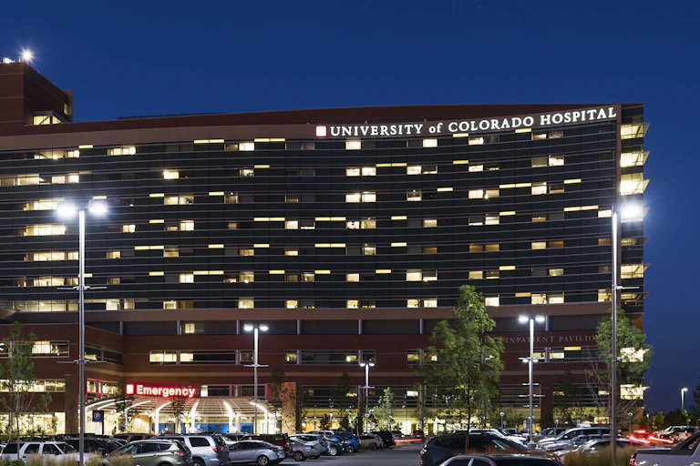University of Colorado Hospital, seen at night with its parking lot out front