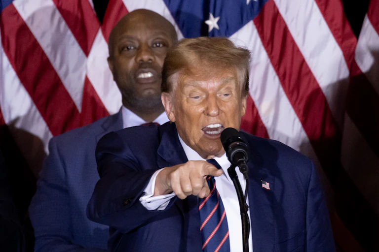 Donald Trump points at an audience member during his victory speech at the New Hampshire primary, January 2024.