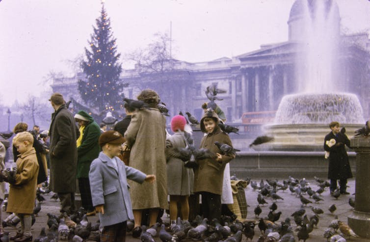 A vintage photograph of people on Trafalgar Square.