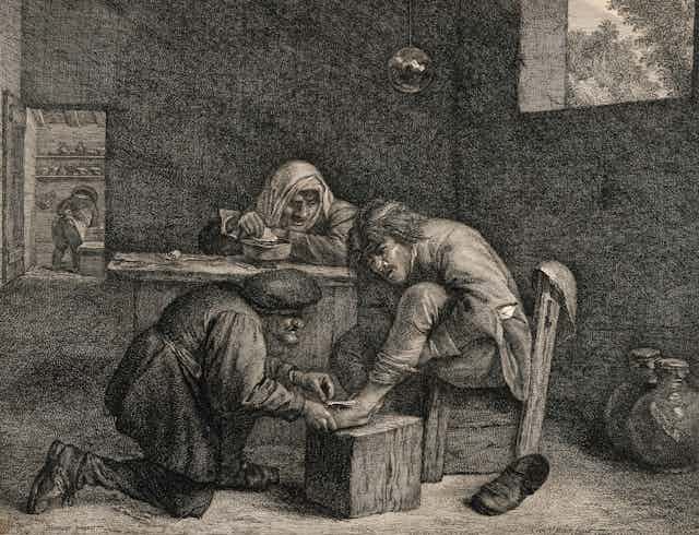 A 19th century drawing of a man treating a wound on a man's foot.