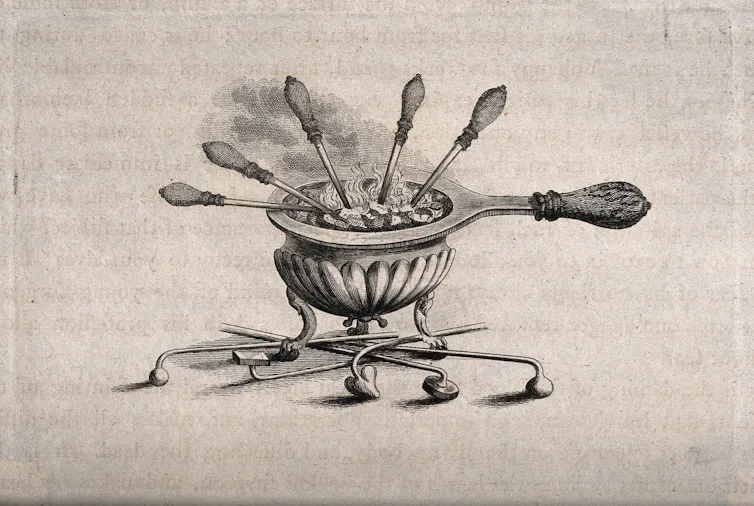 A drawing of a pot containing a fire with several medical instruments poking out of it.