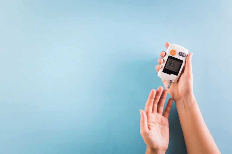 A person with diabetes measures the level of glucose in the blood
