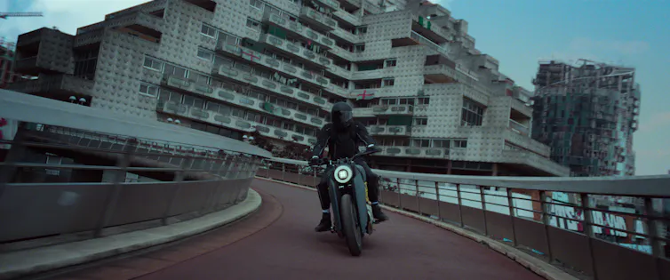 A man on a motorbike.