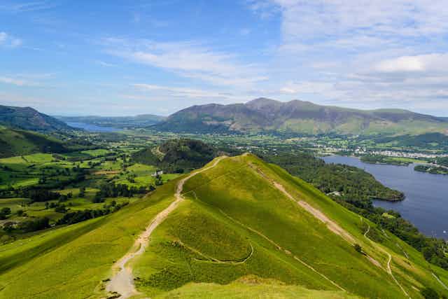 View of Lake District countryside with hilltop path in foreground