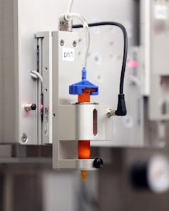 A close-up of a bioprinting machine in a laboratory.